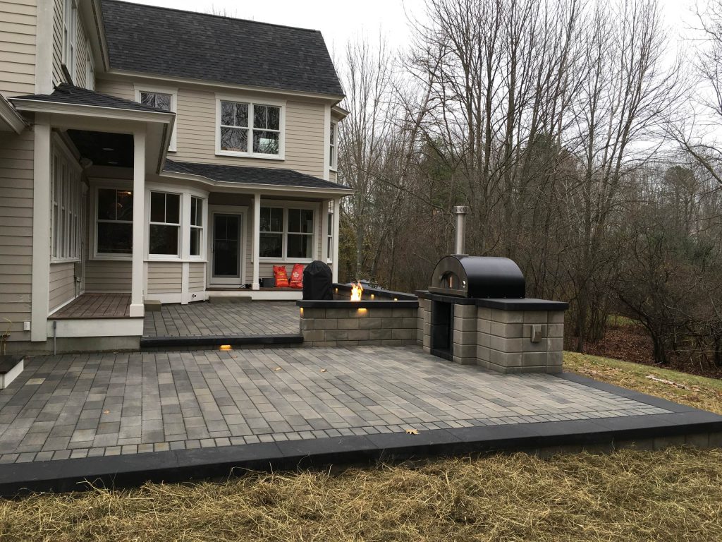 Patio kitchen - large contemporary backyard concrete paver patio kitchen idea in Portland Maine