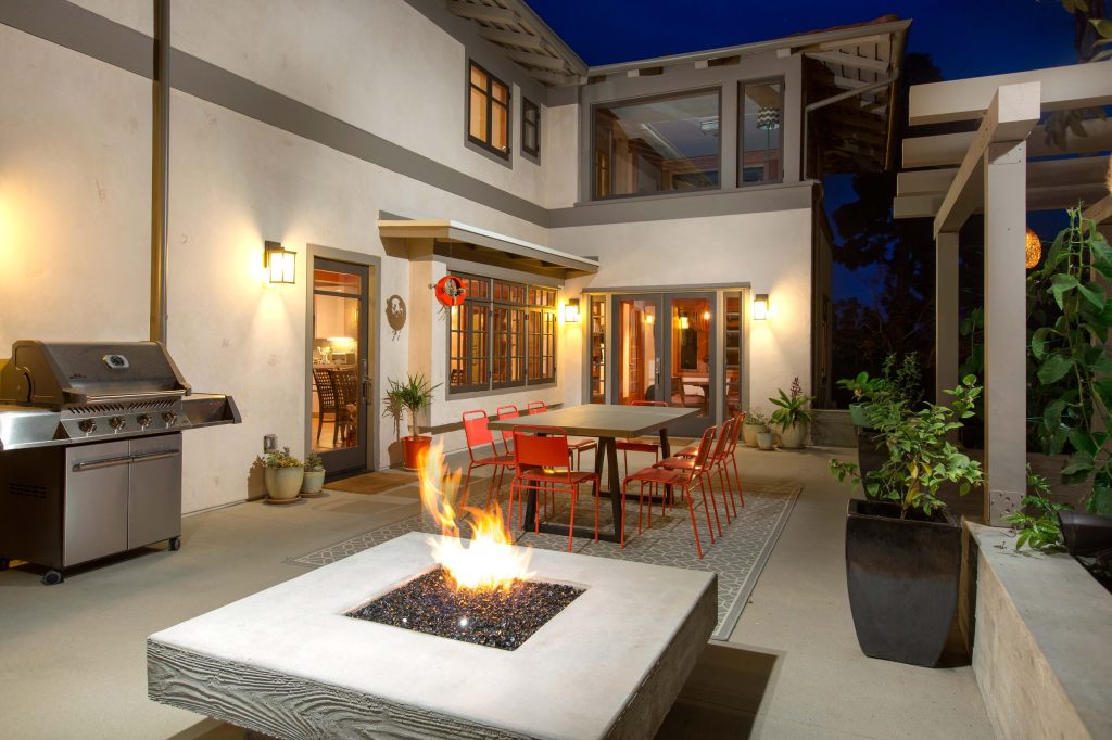 Patio kitchen - large contemporary backyard concrete paver patio kitchen idea in San Diego with no cover