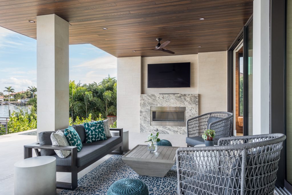 Patio kitchen - large contemporary backyard patio kitchen idea in Tampa with a roof extension