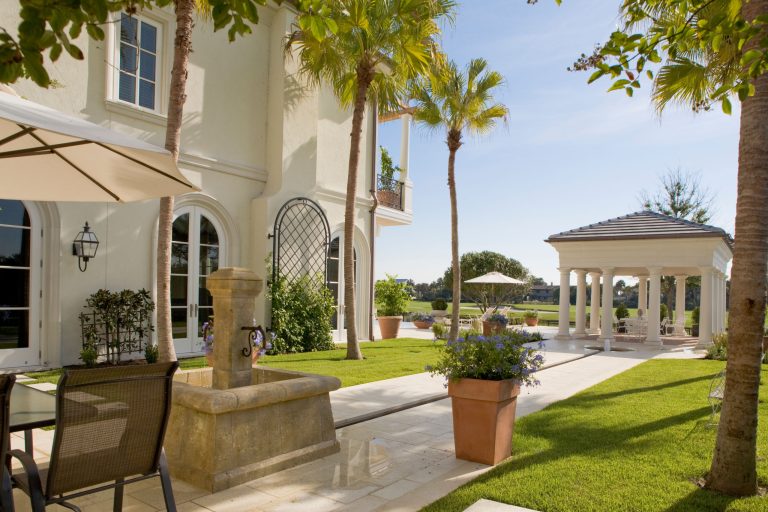 Patio kitchen - large mediterranean backyard patio kitchen idea in Jacksonville with a gazebo