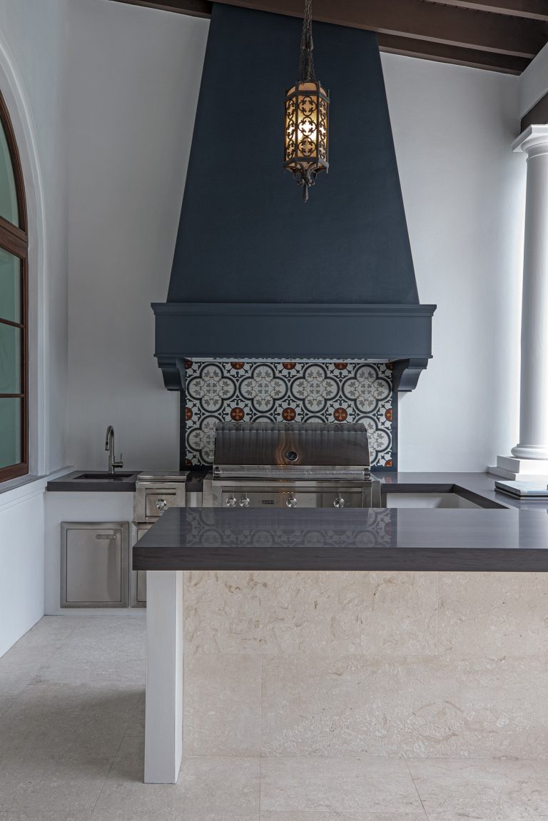 Patio kitchen - large mediterranean backyard tile patio kitchen idea in Miami with a roof extension