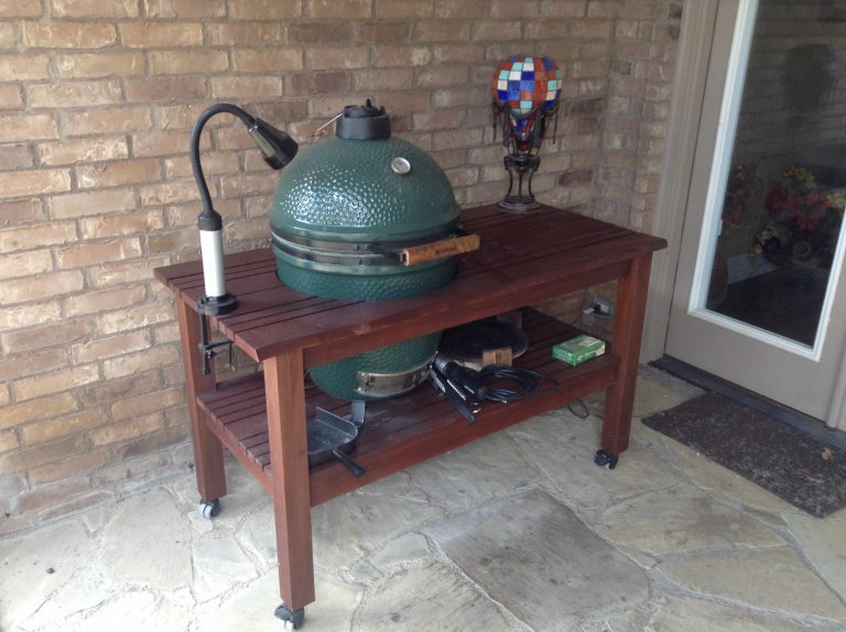 Patio kitchen - large southwestern backyard stone patio kitchen idea in Dallas with a pergola