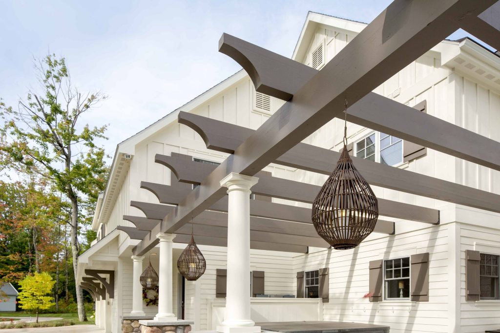 Patio kitchen - large traditional backyard concrete patio kitchen idea in Other with a pergola
