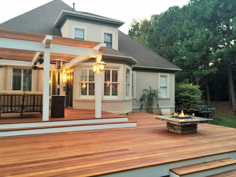 Patio kitchen - large traditional backyard patio kitchen idea in Charlotte with decking and a pergola