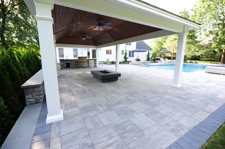 Patio kitchen - large traditional backyard stone patio kitchen idea in Philadelphia with a gazebo