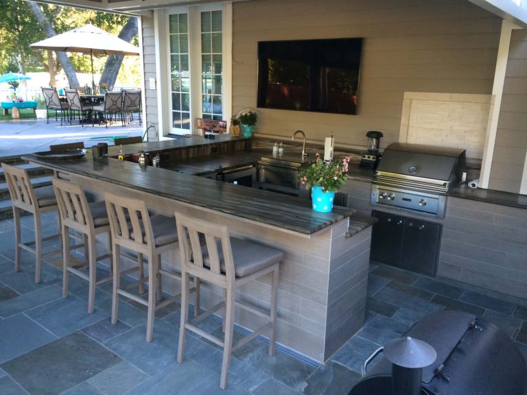 Patio kitchen - large traditional backyard tile patio kitchen idea in Other with a roof extension