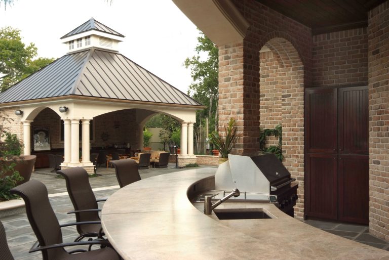 Patio kitchen - large transitional backyard concrete paver patio kitchen idea in Houston with a gazebo