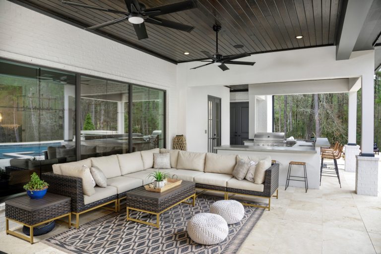 Patio kitchen - large transitional backyard tile patio kitchen idea in Houston with a roof extension