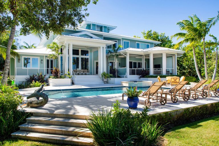 Patio kitchen - large tropical backyard patio kitchen idea in Tampa with decking and a roof extension
