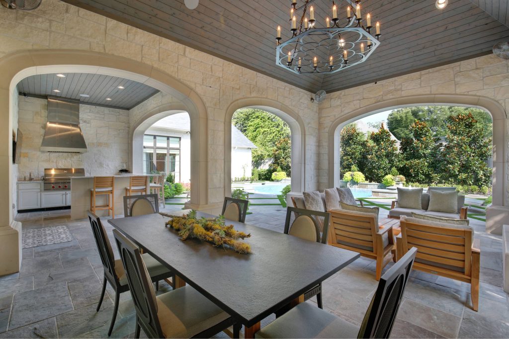 Patio kitchen - mediterranean patio kitchen idea in Dallas with a roof extension