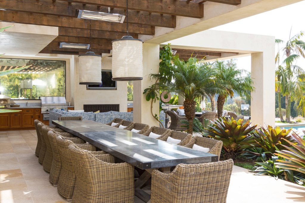 Patio kitchen - mediterranean patio kitchen idea in Los Angeles with a pergola