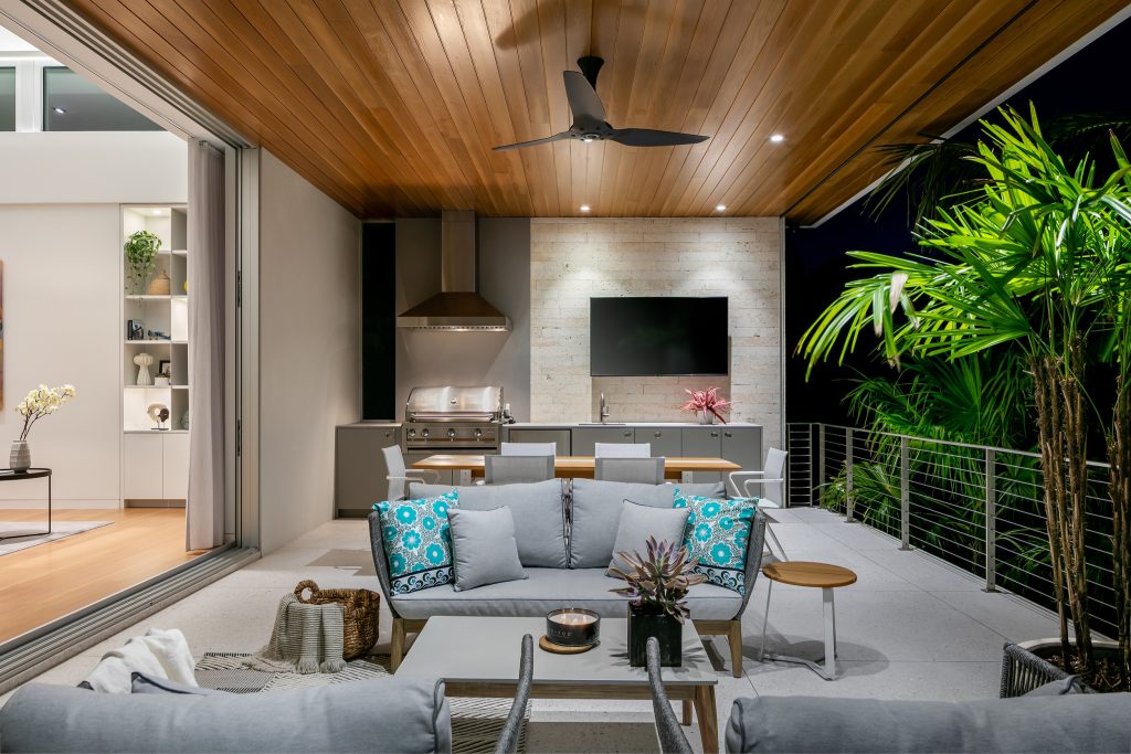 Patio kitchen - mid-sized contemporary backyard concrete patio kitchen idea in Tampa with a roof extension