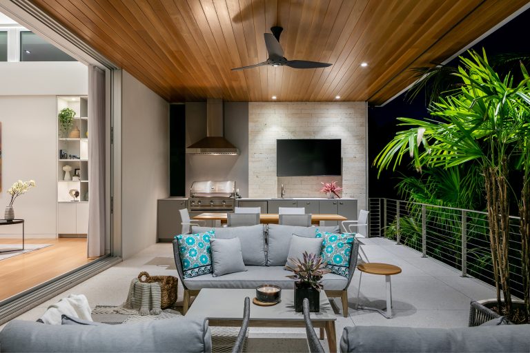 Patio kitchen - mid-sized contemporary backyard concrete patio kitchen idea in Tampa with a roof extension