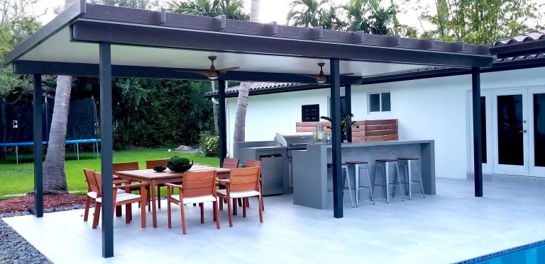 Patio kitchen - mid-sized contemporary backyard concrete paver patio kitchen idea in Miami with a roof extension