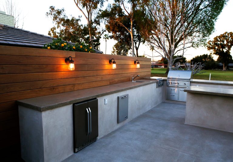 Patio kitchen - mid-sized contemporary backyard concrete paver patio kitchen idea in Salt Lake City with no cover