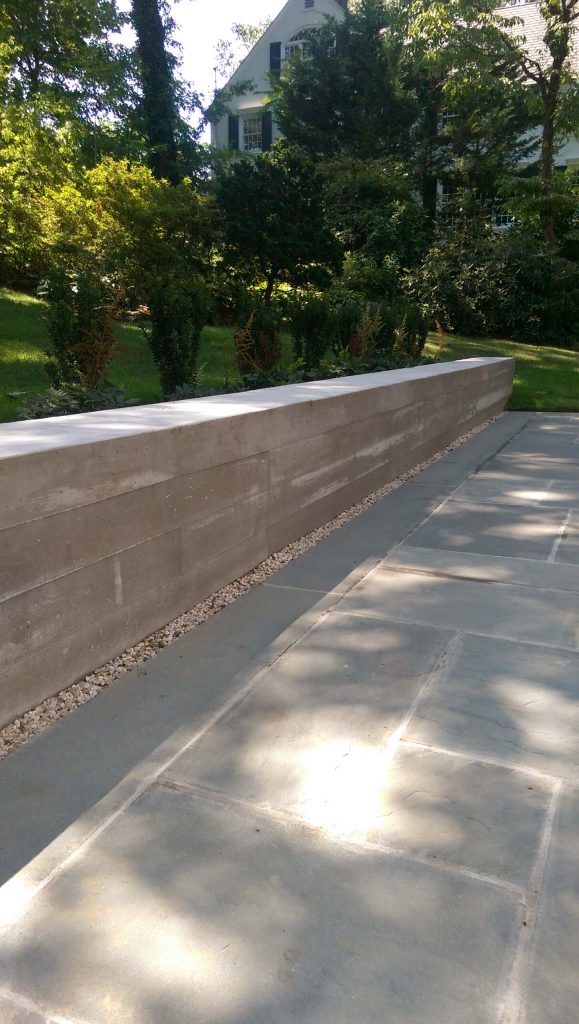 Patio kitchen - mid-sized contemporary backyard stone patio kitchen idea in New York with no cover