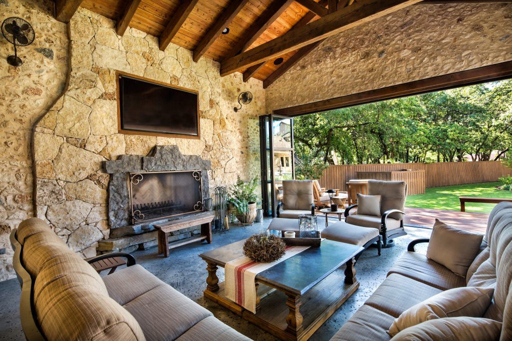 Patio kitchen - mid-sized cottage backyard stamped concrete patio kitchen idea in Dallas with a roof extension