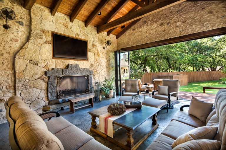 Patio kitchen - mid-sized cottage backyard stamped concrete patio kitchen idea in Dallas with a roof extension