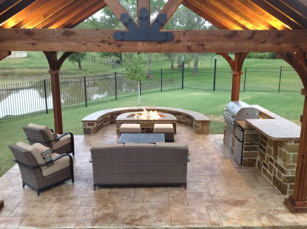 Patio kitchen - mid-sized craftsman backyard stamped concrete patio kitchen idea in Dallas with a gazebo