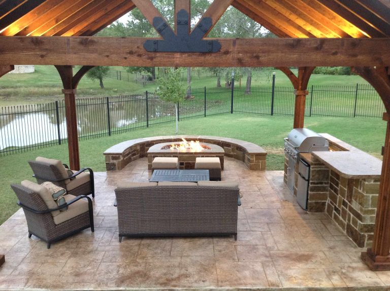 Patio kitchen - mid-sized craftsman backyard stamped concrete patio kitchen idea in Dallas with a gazebo