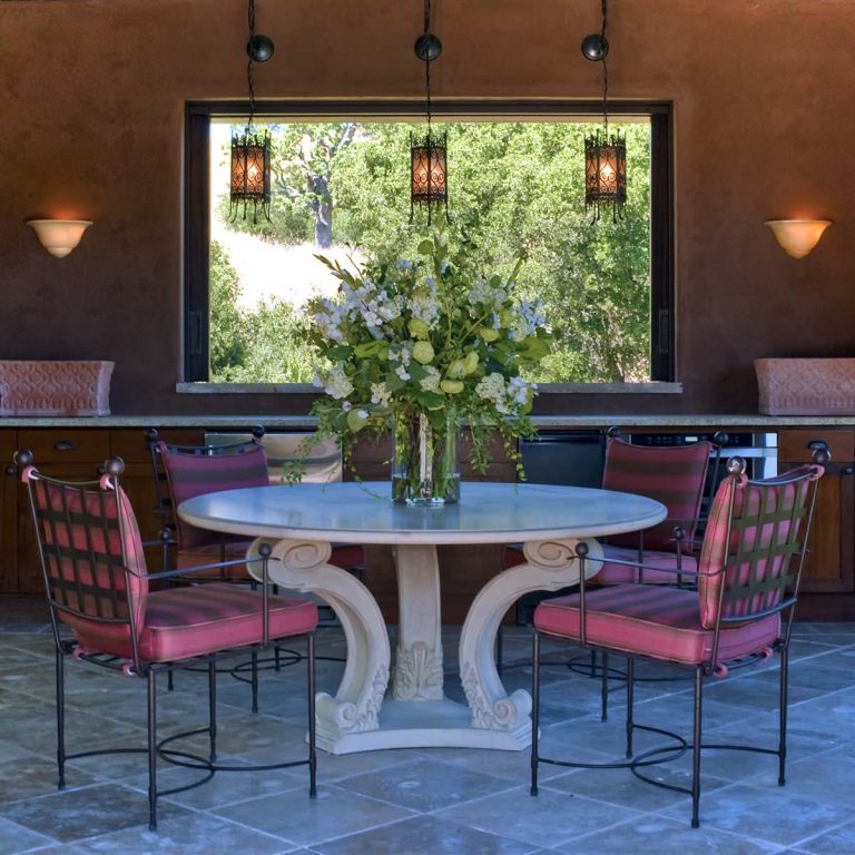Patio kitchen - mid-sized mediterranean backyard stone patio kitchen idea in Other with a gazebo