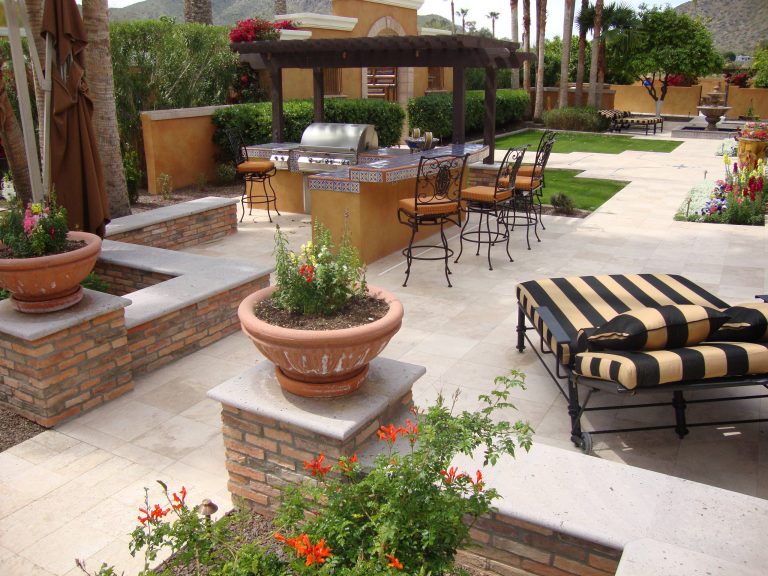 Patio kitchen - mid-sized mediterranean backyard tile patio kitchen idea in Phoenix with a pergola
