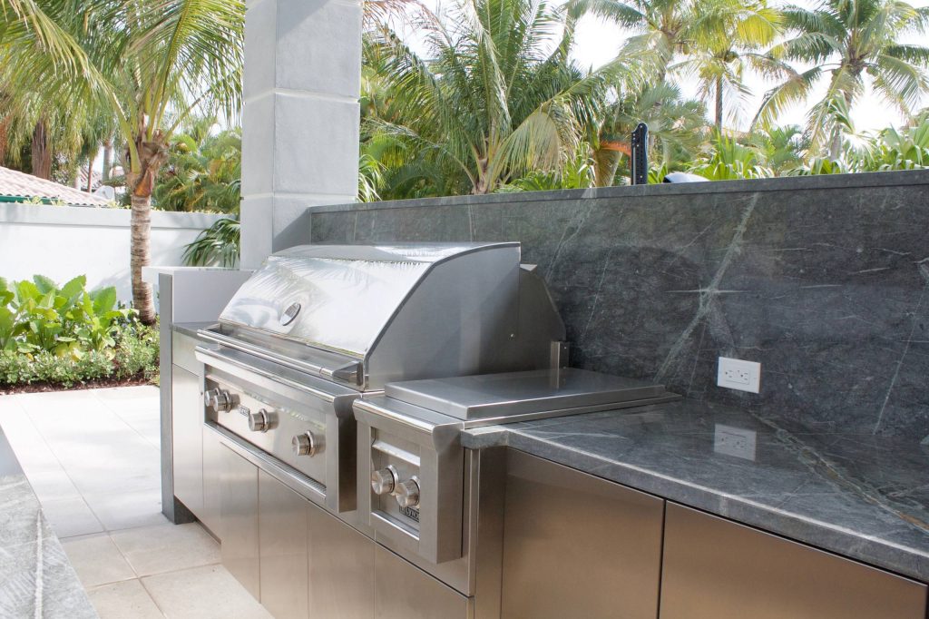 Patio kitchen - mid-sized modern backyard concrete paver patio kitchen idea in Miami with a gazebo