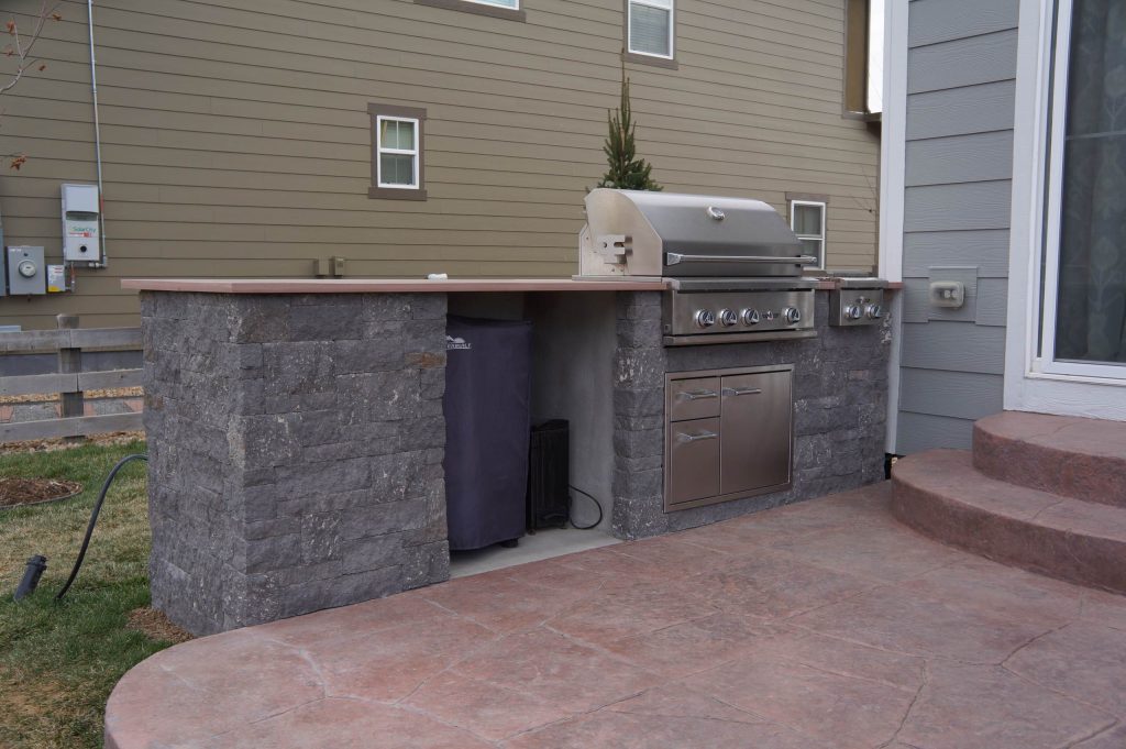Patio kitchen - mid-sized modern backyard stone patio kitchen idea in Denver with no cover