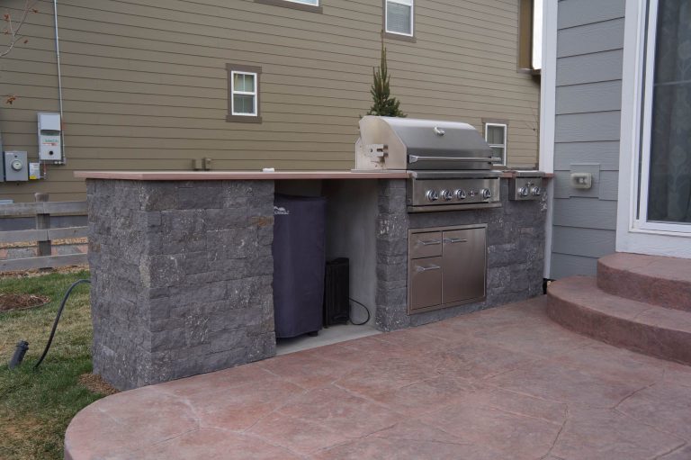 Patio kitchen - mid-sized modern backyard stone patio kitchen idea in Denver with no cover