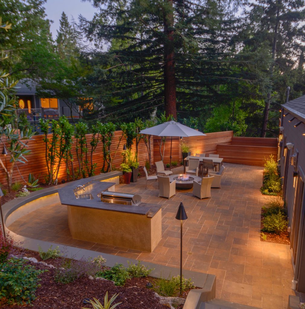 Patio kitchen - mid-sized modern side yard concrete paver patio kitchen idea in San Francisco with no cover
