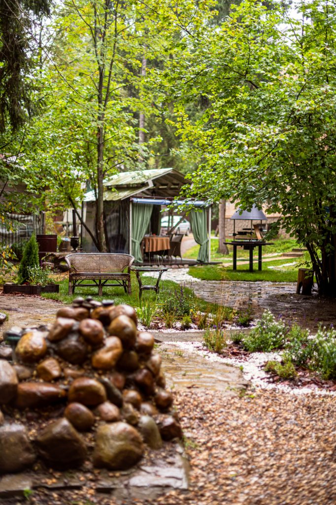 Patio kitchen - mid-sized rustic backyard decomposed granite patio kitchen idea in Moscow with a gazebo