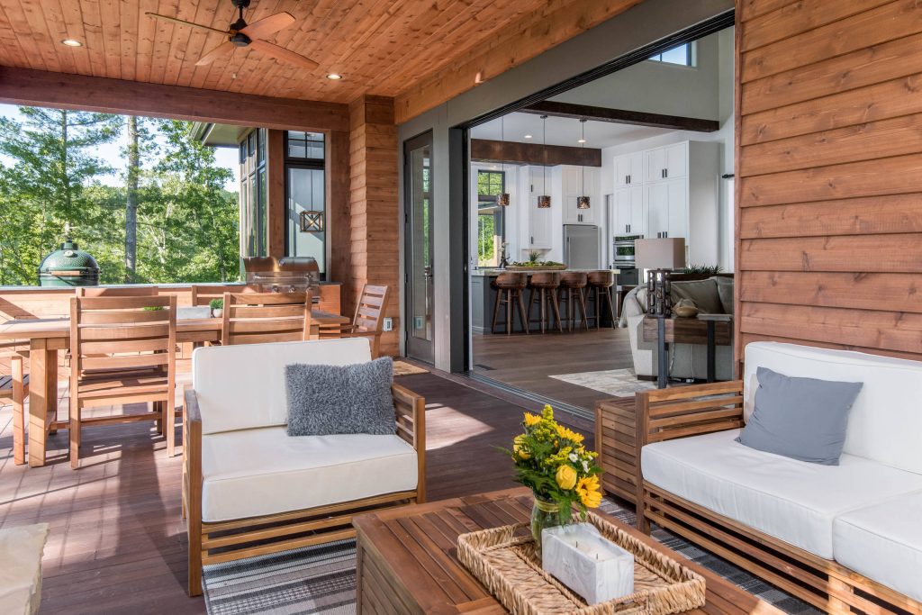 Patio kitchen - mid-sized rustic backyard patio kitchen idea in Other with decking and a roof extension