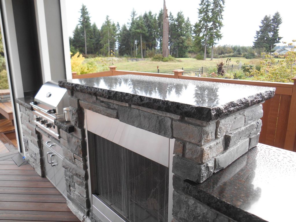 Patio kitchen - mid-sized rustic backyard patio kitchen idea in Seattle with decking and a roof extension