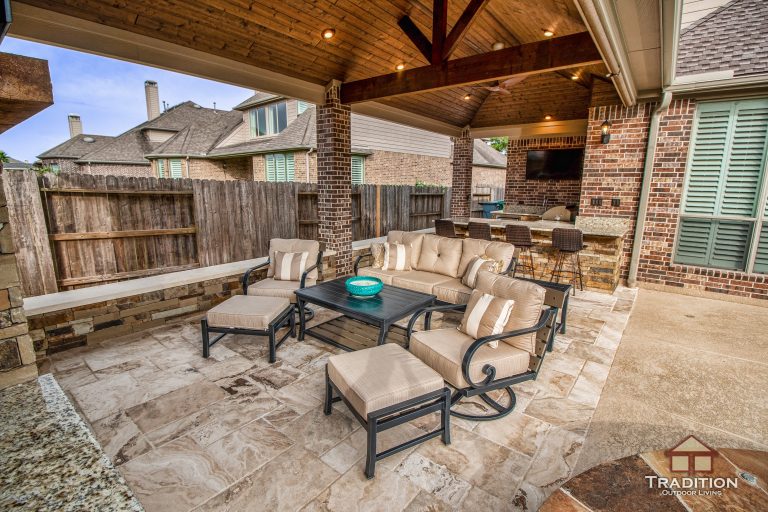 Patio kitchen - mid-sized rustic backyard stamped concrete patio kitchen idea in Houston with a roof extension