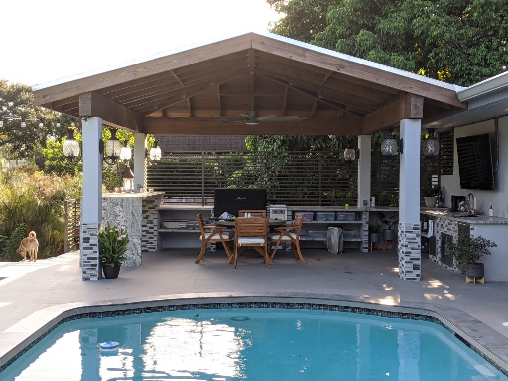 Patio kitchen - mid-sized southwestern backyard tile patio kitchen idea in Miami with a gazebo