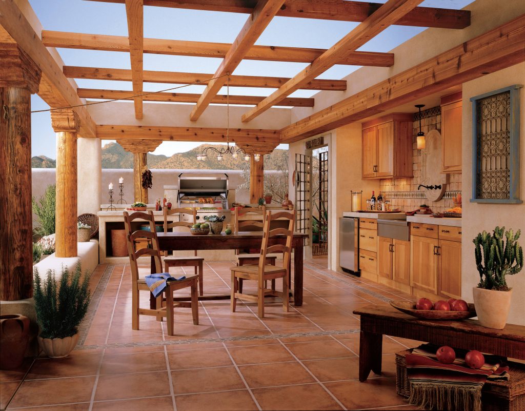 Patio kitchen - mid-sized southwestern tile patio kitchen idea in Denver with a pergola