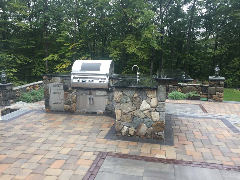 Patio kitchen - mid-sized traditional backyard brick patio kitchen idea in Boston with no cover