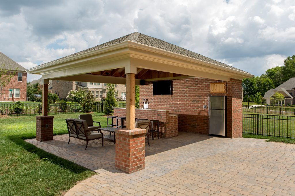 Patio kitchen - mid-sized traditional backyard brick patio kitchen idea in Charlotte with a gazebo