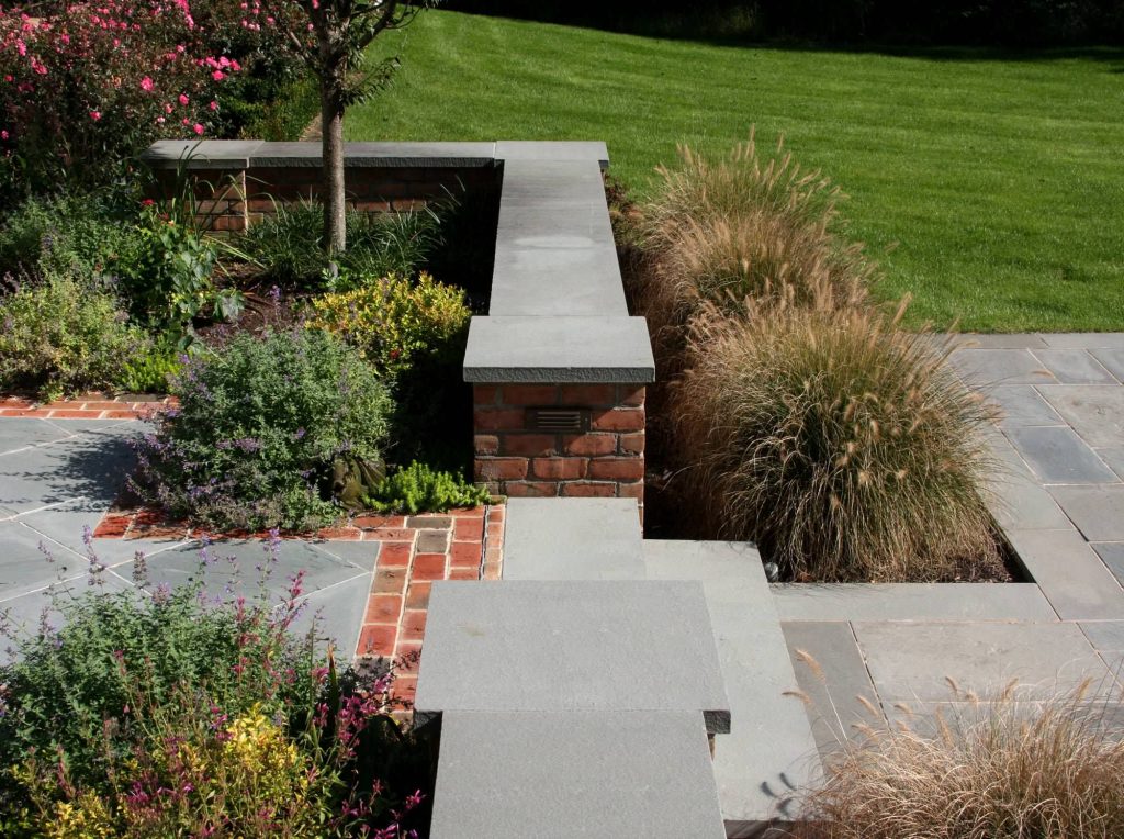 Patio kitchen - mid-sized traditional backyard concrete paver patio kitchen idea in New York with no cover