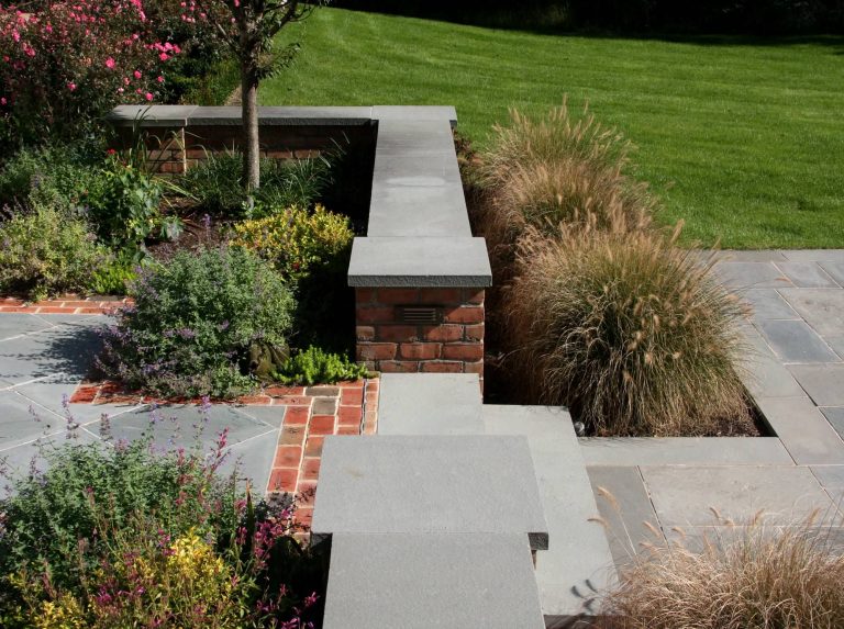 Patio kitchen - mid-sized traditional backyard concrete paver patio kitchen idea in New York with no cover