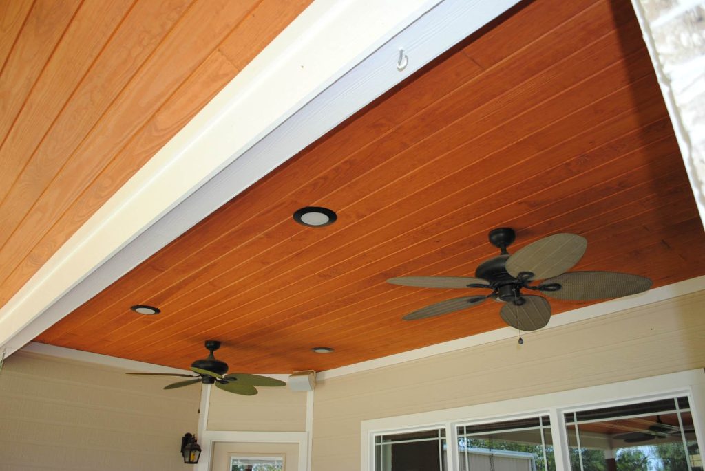 Patio kitchen - mid-sized traditional backyard stamped concrete patio kitchen idea in Houston with a roof extension
