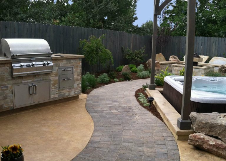 Patio kitchen - mid-sized transitional backyard brick patio kitchen idea in Boise with no cover