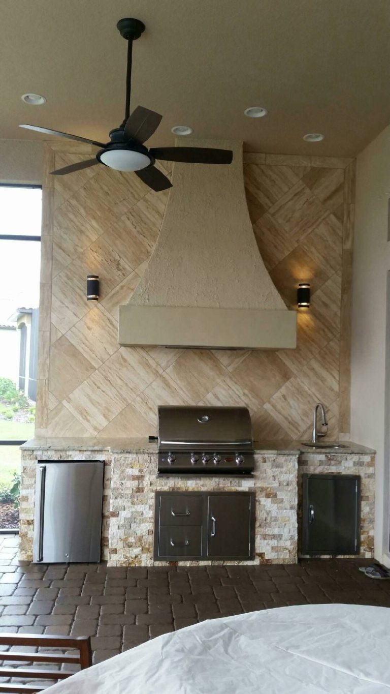 Patio kitchen - mid-sized transitional backyard brick patio kitchen idea in Tampa with a pergola