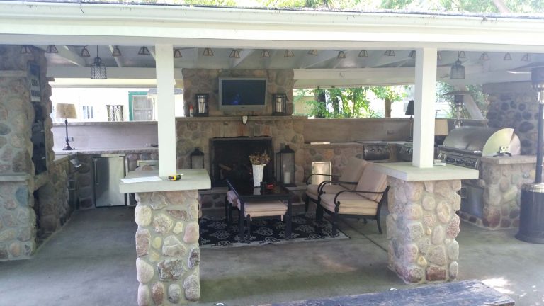 Patio kitchen - mid-sized transitional backyard concrete patio kitchen idea in Milwaukee with a gazebo