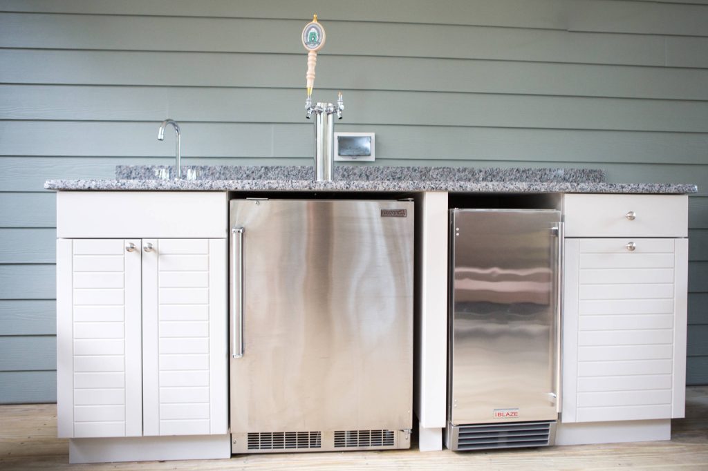 Patio kitchen - mid-sized transitional backyard patio kitchen idea in Other with decking and a roof extension
