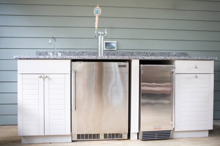 Patio kitchen - mid-sized transitional backyard patio kitchen idea in Other with decking and a roof extension
