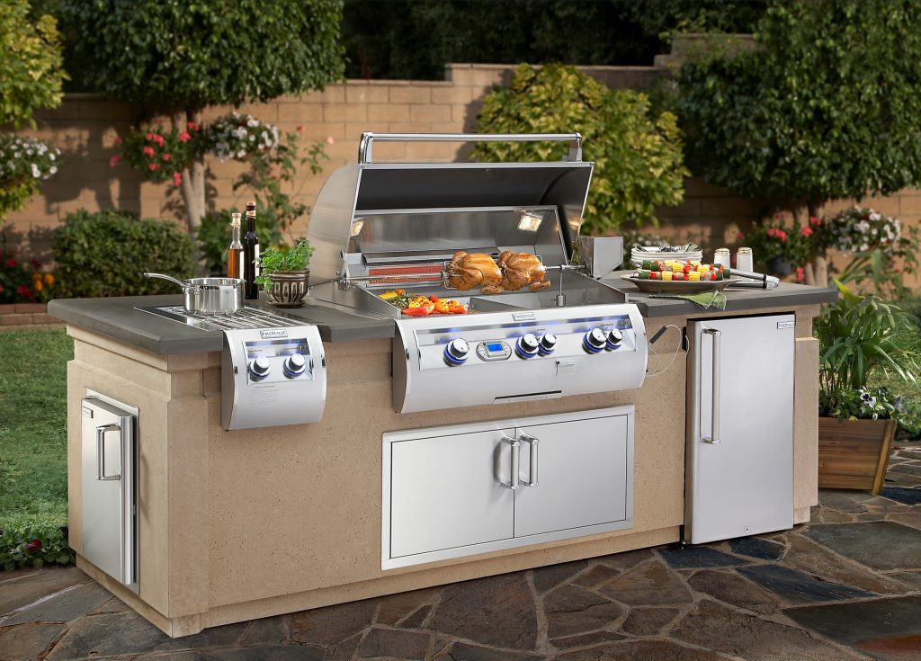 Patio kitchen - mid-sized transitional backyard stone patio kitchen idea in Los Angeles with no cover