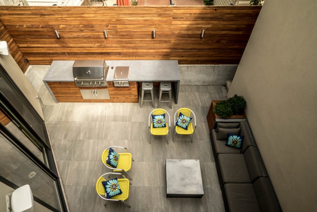 Patio kitchen - mid-sized transitional backyard tile patio kitchen idea in Orange County with no cover