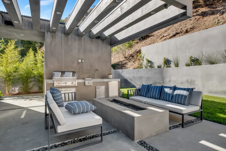 Patio kitchen - mid-sized transitional concrete patio kitchen idea in Los Angeles with a pergola