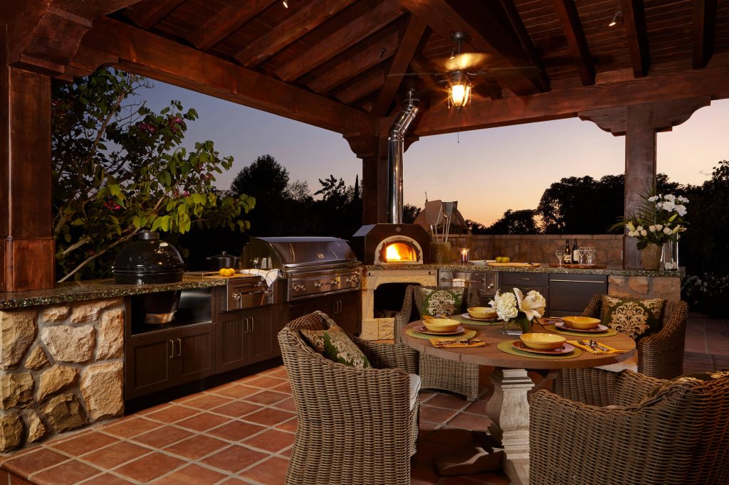Patio kitchen - rustic tile patio kitchen idea in Santa Barbara with a gazebo